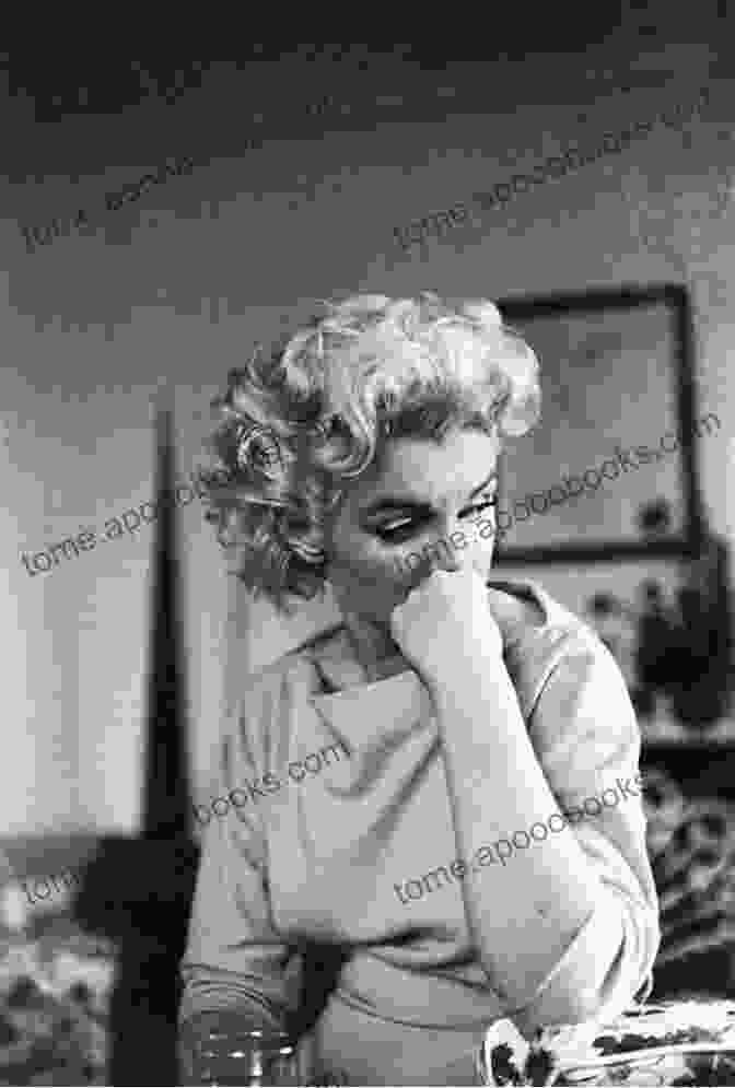 A Candid Photograph Of Marilyn Monroe, Revealing A Moment Of Vulnerability And Contemplation. Goddess: The Secret Lives Of Marilyn Monroe