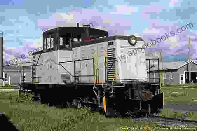 A Detroit Mackinac Railway Locomotive Crossing A Wooden Trestle Amid A Verdant Forest The Railfan Chronicles Detroit Mackinac Railway Volume 1 1975 To 1987