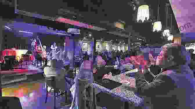 A Photograph Of A Jazz Club In Akron, With Musicians Performing On Stage And People Gathered Around Tables, Listening And Enjoying The Music. Instructions BetweenTakeoff And Landing (Akron In Poetry)