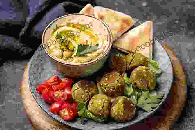 A Plate Of Hummus, Falafel, And Pita Bread, Popular Israeli Dishes Travel Guide Tel Aviv : Your Ticket To Discover Tel Aviv (Travel With Safer : Complete Guides Of The World Best Cities)