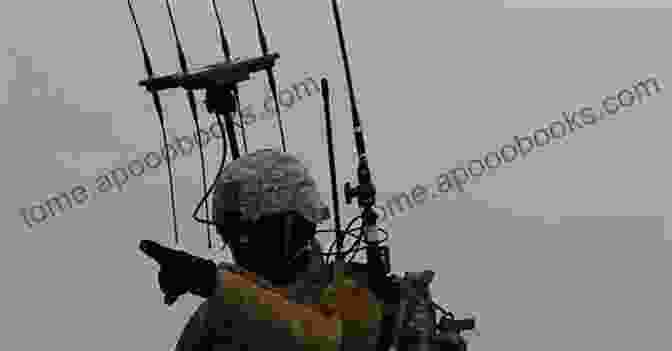 A Soldier Using Electronic Warfare Equipment To Disrupt Enemy Communications. CYBERSPACE AND ELECTRONIC WARFARE OPERATIONS