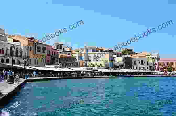 Bustling Harbor Of Chania, Featuring Colorful Buildings, Traditional Boats, And A Lively Waterfront Promenade. Crete Travel Guide Apostolis Heretis Hadoulis